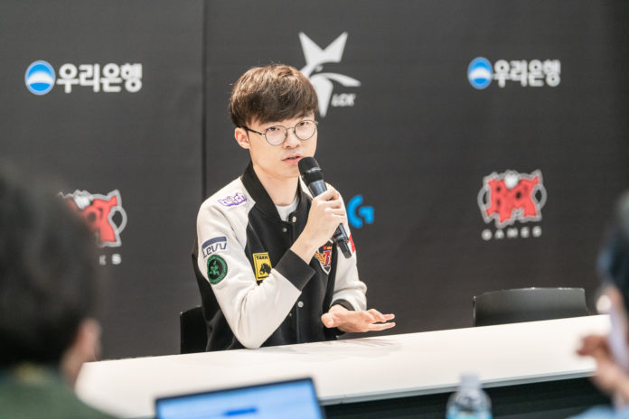 Faker holding a mic